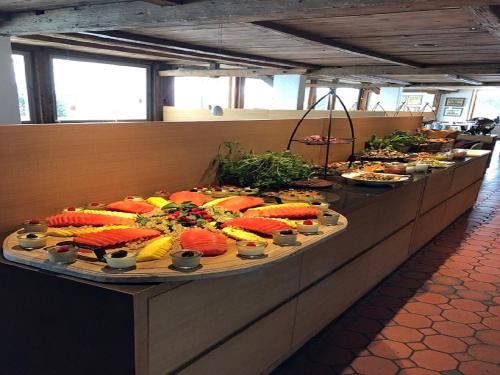 a buffet line with many different types of food at Marina Hotel am Starnberger See in Bernried