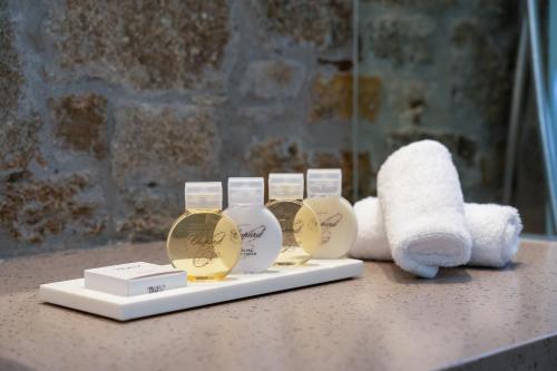 a group of three gold and white trophies on a counter at Semeli Hotel Mykonos in Mýkonos City