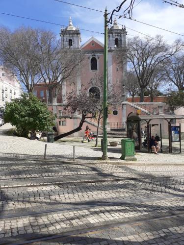 a bus stop in front of a church at Central Lisbon Studio in Lisbon