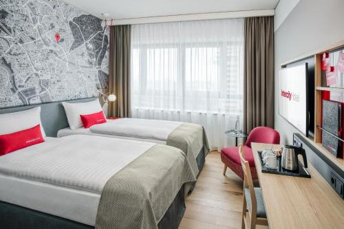 Ένα ή περισσότερα κρεβάτια σε δωμάτιο στο IntercityHotel Hannover Hauptbahnhof-Ost