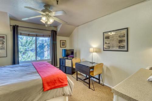 a bedroom with a bed and a desk and a window at Park City Getaway in Park City
