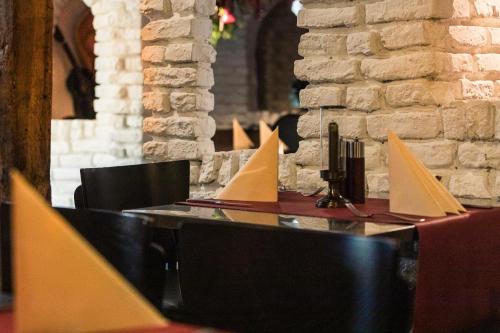 a table with white papers on top of it at Hotel Allegra in Heinsberg