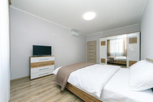 Posteľ alebo postele v izbe v ubytovaní New VIP Apartments