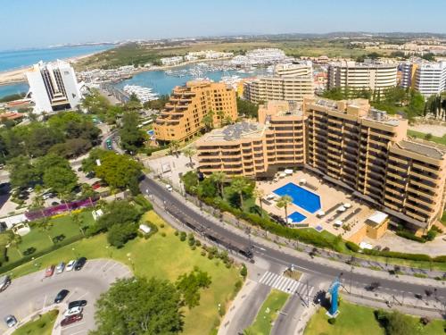 
a large city with a large building at Dom Pedro Portobelo in Vilamoura
