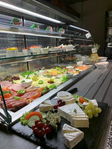 a buffet line with many different types of food at Hotel Bispinger Hof in Bispingen
