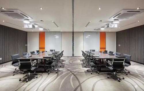 a conference room with a long table and chairs at Holiday Inn Express Seoul Hongdae by IHG in Seoul