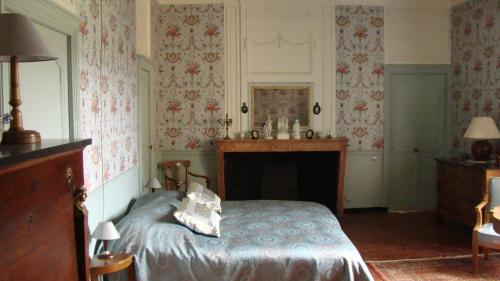 Un ou plusieurs lits dans un hébergement de l'établissement Château d'Ozenay