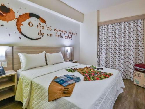 Postel nebo postele na pokoji v ubytování ibis Styles Vitoria da Conquista