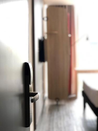 an open door of a room with a door at ibis Chia in Chía