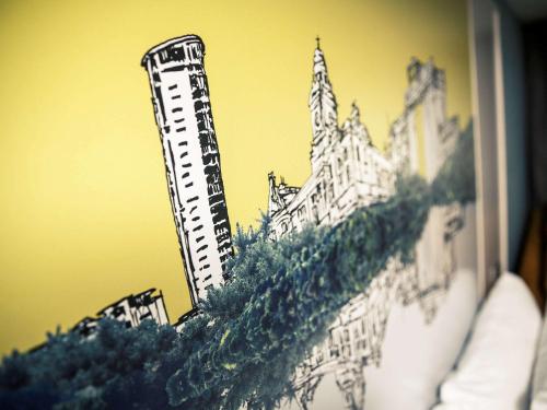 a drawing of a building on a wall at Mercure Swansea Hotel in Swansea