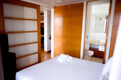 A bed or beds in a room at ExMonarca by Design