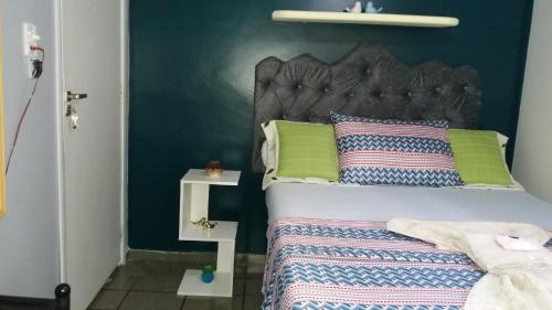 Кровать или кровати в номере Suíte Fiore Ponta Verde