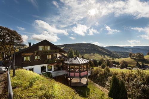 a house sitting on top of a hill at Panorama Sonnenalm Hochschwarzwald in Todtnauberg