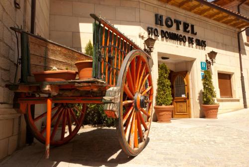 a wooden cart parked outside of a building at Hotel Santo Domingo de Silos in Santo Domingo de Silos