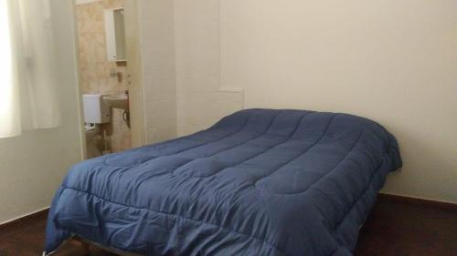Una cama o camas en una habitación de Departamento en el corazon de barrio General Paz