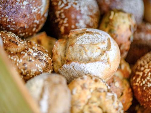 a pile of bagels in a box at ibis Styles Basel City in Basel