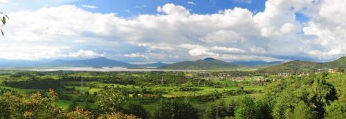 a view of a valley with a lake and mountains at Porton del Cielo in Pátzcuaro