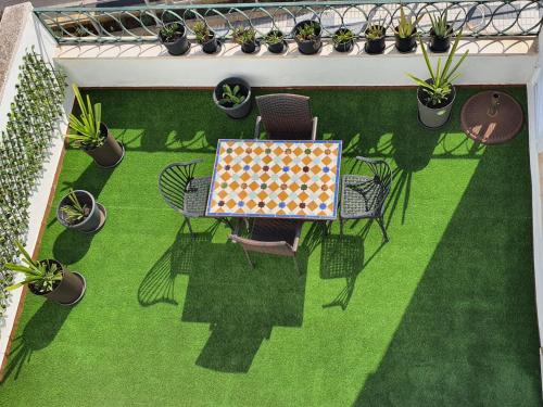 an overhead view of a patio with a table and chairs at El Balcón del Puerto in Ayamonte