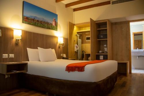 a bedroom with a large bed in a room at Casa Andina Standard Chincha in Chincha Alta