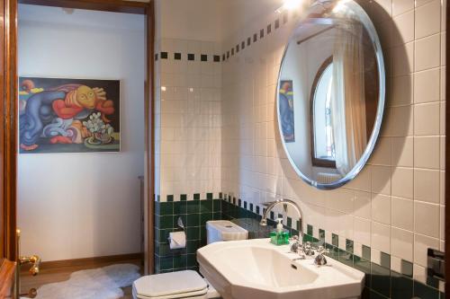 a bathroom with a sink and a mirror at Da Noi Due in Bergamo