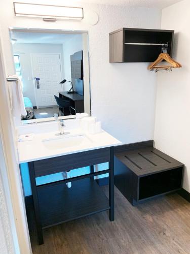 a bathroom with a sink and a mirror at Motel 6-Amarillo, TX - Airport in Amarillo
