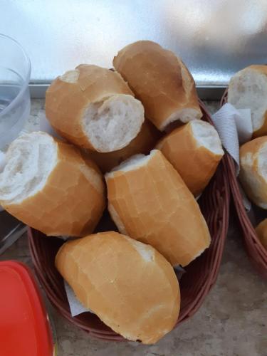 a basket filled with lots of bread at Bento palace hotel in Assis