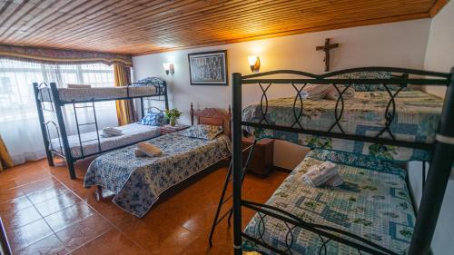 Postel nebo postele na pokoji v ubytování Vivienda Turística "El Coronel"