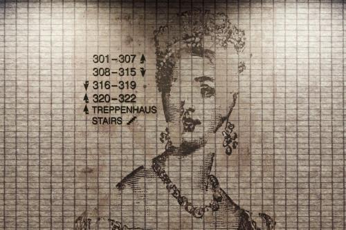 a drawing of a woman with grapes on a grid at Hotel Indigo Dresden - Wettiner Platz by IHG in Dresden