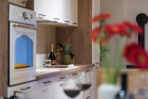 a kitchen with a counter with a pineapple on it at Villa Kameni dvori in Sveti Filip i Jakov