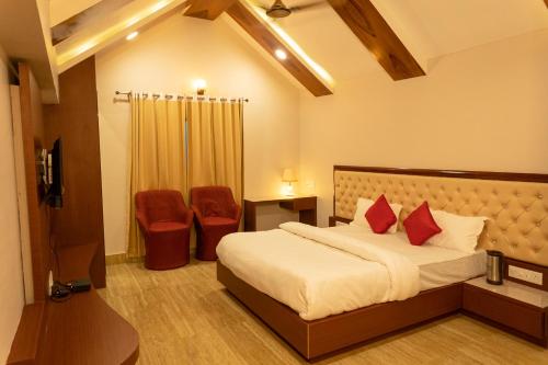Postel nebo postele na pokoji v ubytování Riddhi Siddhi Resorts