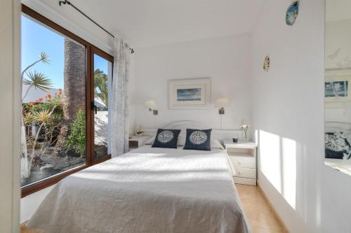 Postel nebo postele na pokoji v ubytování Bungalow Playa Bastián