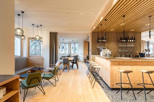 
a kitchen with a dining room table and chairs at Thalers Mariandl in Schladming
