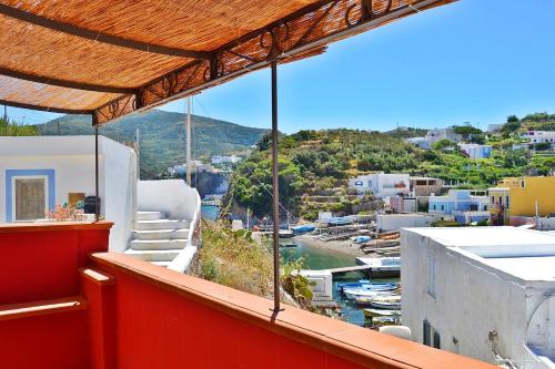 a balcony with a view of a marina at Maridea - Fragolino in Ponza