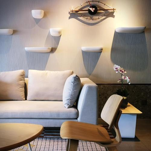 a living room with a couch and a table at FOX Lite Hotel DPulze Cyberjaya in Cyberjaya
