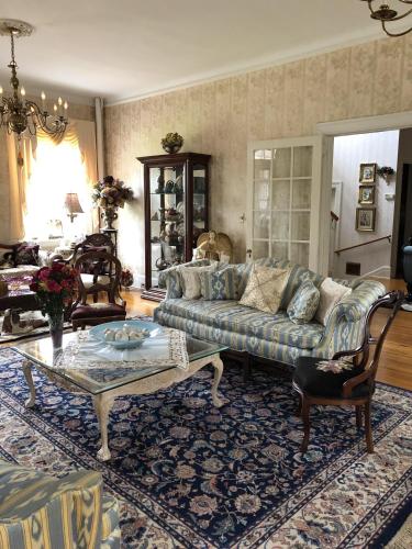 a living room with a couch and a coffee table at Angies B&B in Wilmington