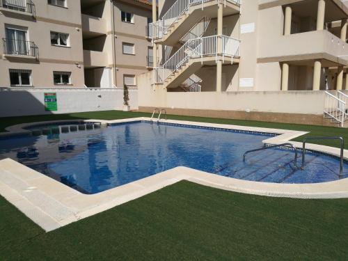 Kolam renang di atau dekat dengan Apartamento con piscina y terraza con vista al mar