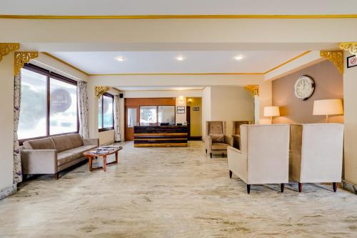 a lobby with couches and a waiting room at Mount Himalayan Hotel in Gangtok