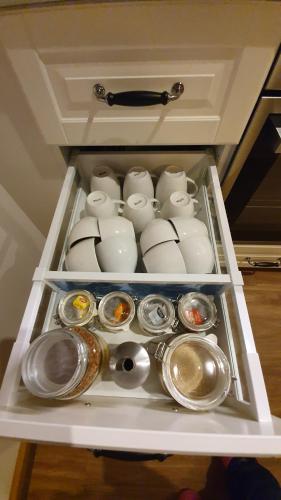 a drawer with dishes and utensils in it at Amble at Hahndorf in Hahndorf