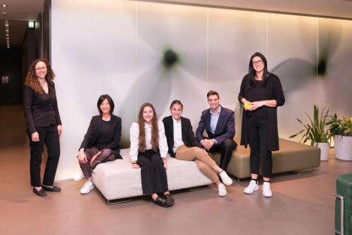 a group of people sitting on a couch at Point Hotel in Piove di Sacco