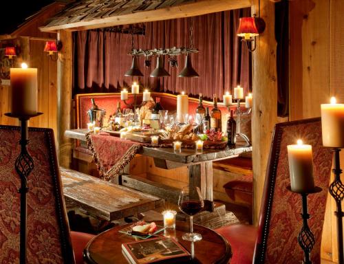 a dining room with a table with candles and candles at Rustic Inn Creekside in Jackson