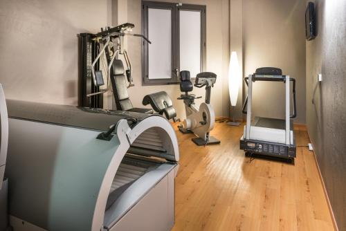 a room with a gym with exercise equipment in it at Point Hotel in Piove di Sacco