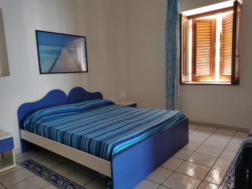 Postel nebo postele na pokoji v ubytování ANFORA Blu