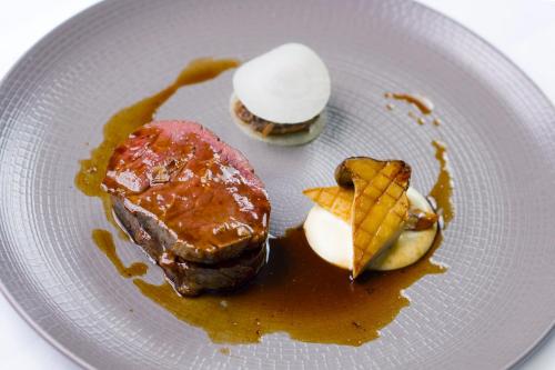 a plate of food with ice cream and dessert at The Reserve at Muckross Park in Killarney