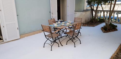 a table and chairs sitting on a patio at Maridea - Salina in Ponza