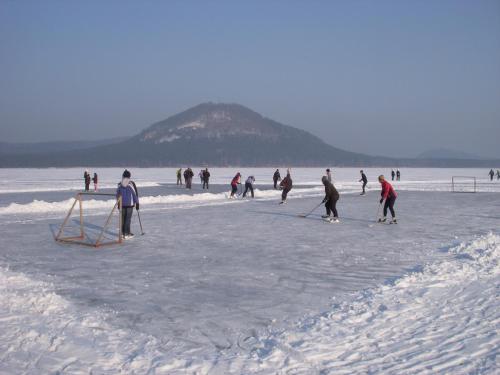 a group of people playing in the snow at Rezidence Fami Deluxe Design in Staré Splavy
