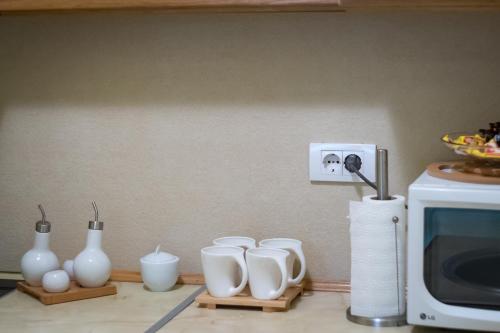 Utensilios para hacer té y café en DuMalux apartment