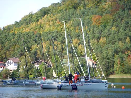 a group of boats are docked in the water at Rezidence Fami Deluxe Design in Staré Splavy