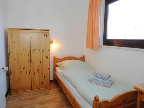 Ένα ή περισσότερα κρεβάτια σε δωμάτιο στο La Casa Ferienwohnung Strandlaeufer