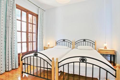 Postel nebo postele na pokoji v ubytování Villa Alexandros