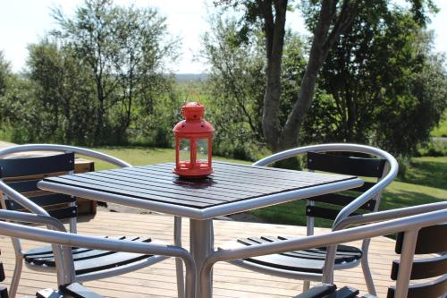a red lantern sitting on top of a table at Fagrahlíd Guesthouse in Hvolsvöllur